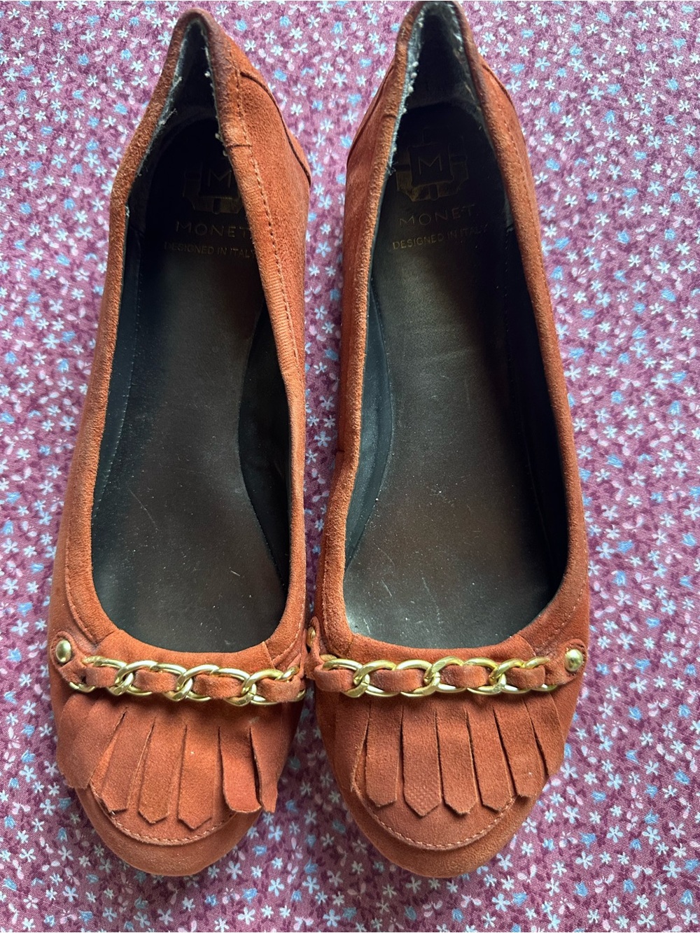 Monet Rust Suede Fringe Loafers with Gold Chain Accent